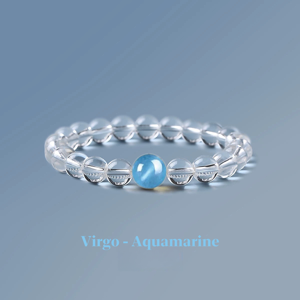 Clear quartz zodiac bracelet from the Healing Jewellery collection, featuring a central aquamarine bead. Designed for Virgo, this bracelet combines the clarity of quartz with the calming, soothing energy of aquamarine.