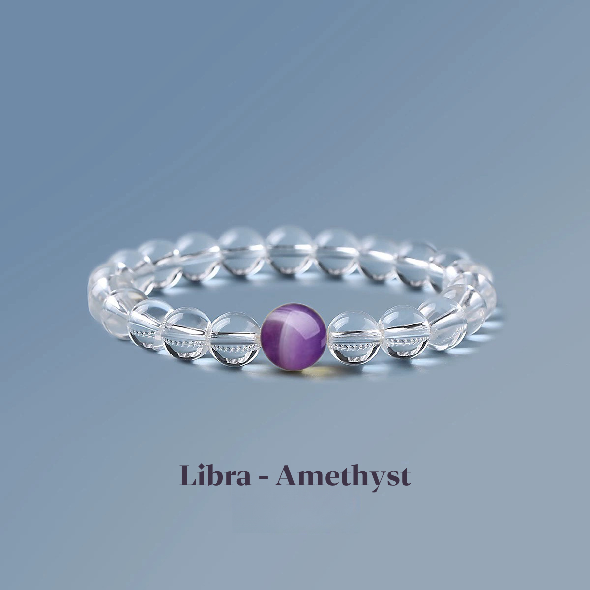 Clear quartz zodiac bracelet from the Healing Jewellery collection, featuring a central amethyst bead. Designed for Libra, this bracelet combines the clarity of quartz with the calming, spiritual energy of amethyst.