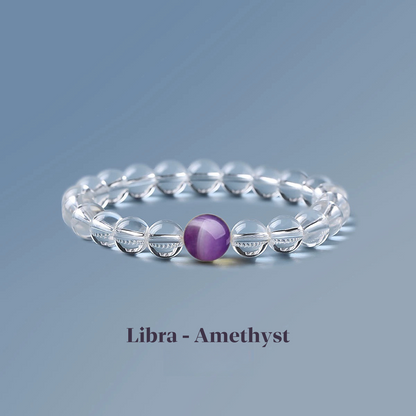 Clear quartz zodiac bracelet from the Healing Jewellery collection, featuring a central amethyst bead. Designed for Libra, this bracelet combines the clarity of quartz with the calming, spiritual energy of amethyst.