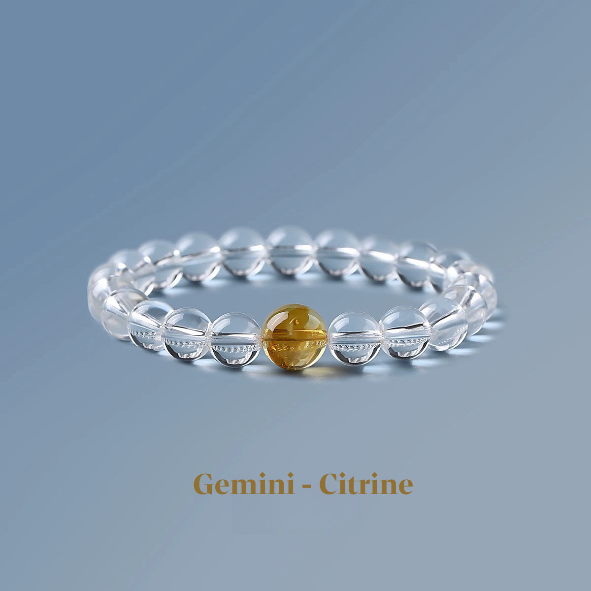 Clear quartz zodiac bracelet from the Healing Jewellery collection, featuring a central citrine bead. Designed for Gemini, this bracelet combines the clarity of quartz with the vibrant, energising qualities of citrine.