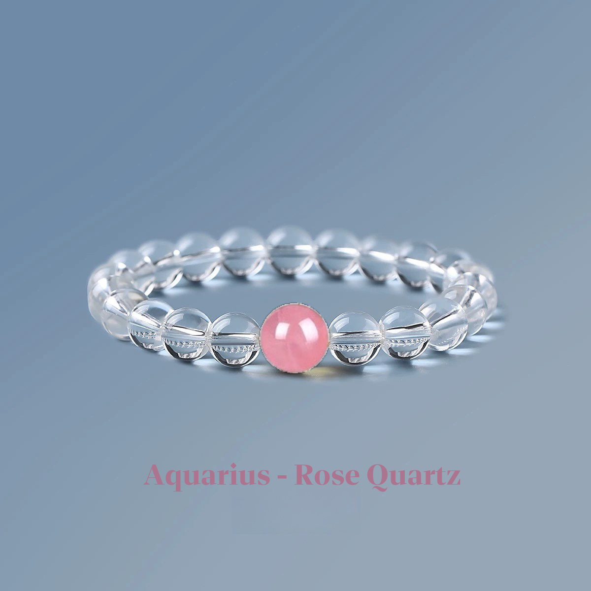 Clear quartz zodiac bracelet from the Healing Jewellery collection, featuring a central rose quartz bead. Designed for Aquarius, this bracelet combines the clarity of quartz with the gentle, loving energy of rose quartz.