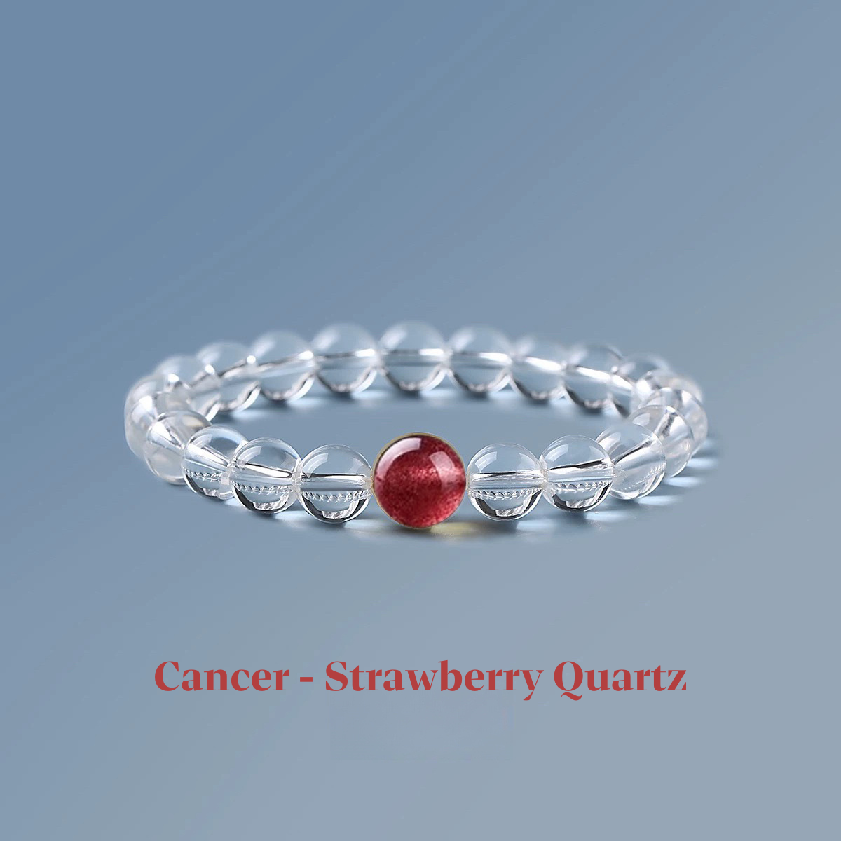 Clear quartz zodiac bracelet from the Healing Jewellery collection, featuring a central strawberry quartz bead. Designed for Cancer, this bracelet combines the clarity of quartz with the nurturing, loving energy of strawberry quartz.